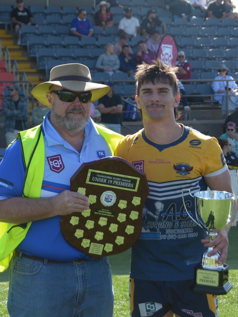 Highfields Eagles Under 19 captain Declan Ryan receives the trophy on TRL grand final day at Clive Berghofer Stadium on Saturday September 16, 2023.