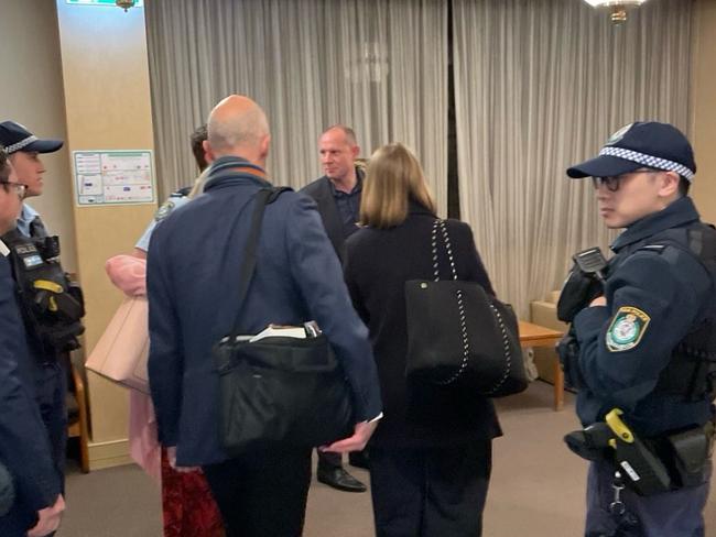 Councillors escorted out of the meeting by police.