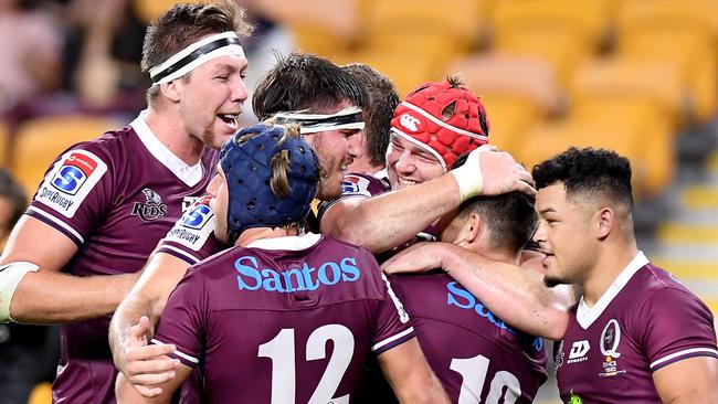 Teammates celebrate James O’Connor’s try. Picture: Bradley Kanaris/Getty