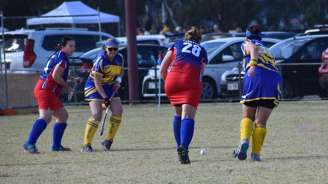 Angela Groves in possession for Warwick against Townsville at the 2021 Queensland Hockey Women's Masters Championship at Queens Park.