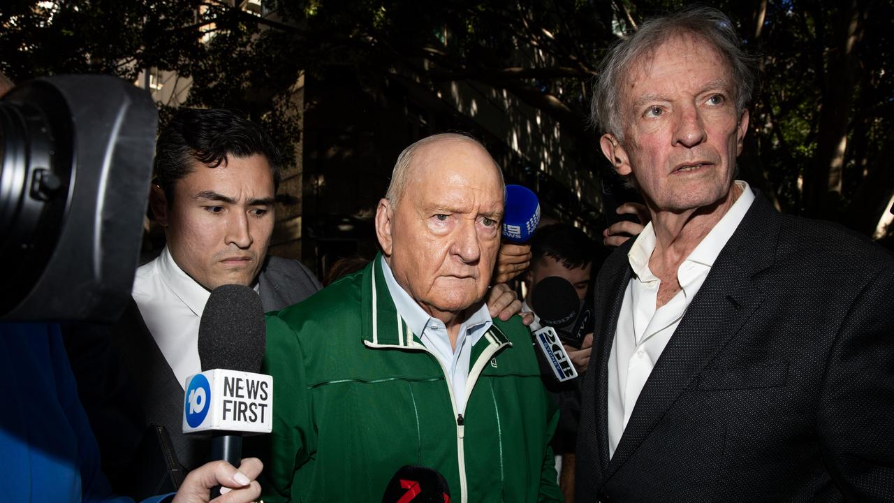 The veteran broadcaster flanked by his lawyers, Bryan Wrench (left) and Chris Murphy. Picture: Liam Mendes / The Australian