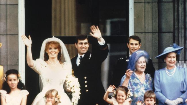 Prince Andrew, the Duke of York and now ex-wife Sarah Ferguson at their wedding in 1986, while Queen Elizabeth II and Queen Mother look on. Picture: AFP.