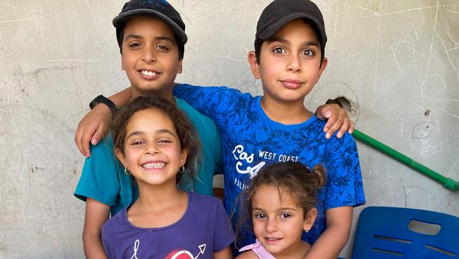 Dujana, 11, and Haritha, 10, with their sisters JuJu, 7 and Sumaya, 5, are being held in al-Roj camp with their mother Mariam Raad. Picture: Ellen Whinnett