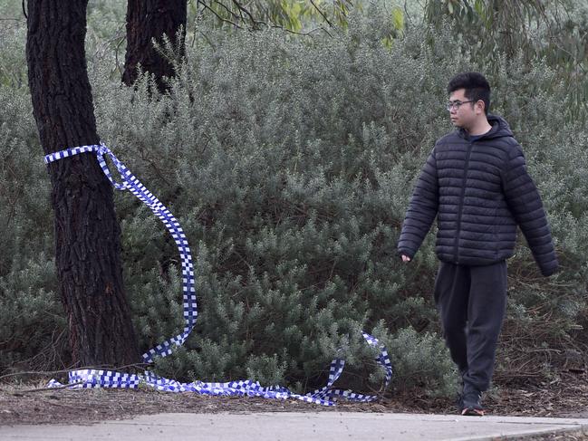 Police tape at the spot where the man was found fatally wounded. Picture: Andrew Henshaw