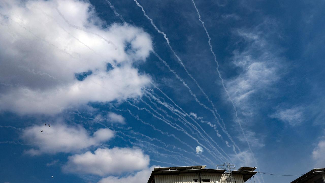 Rockets fired by Palestinian militants in the Gaza Strip are intercepted by Israel's Iron Dome defence missile system over Sderot. Picture: AFP