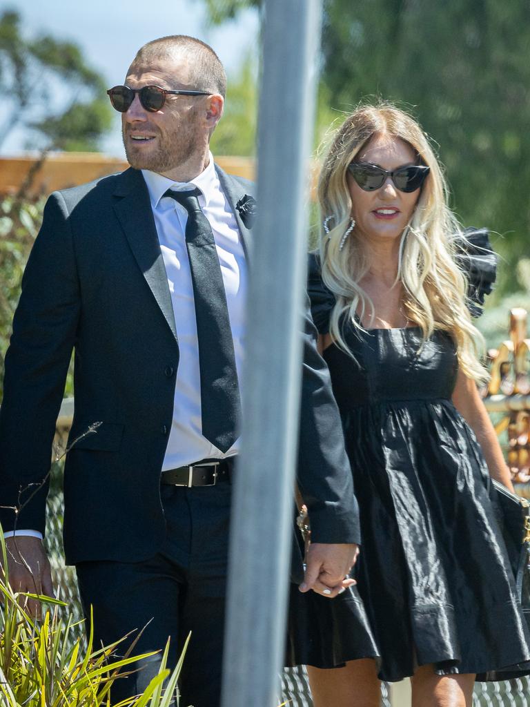 Simon Goodwin and Kristine Brooks held hands as they arrived at the wedding.