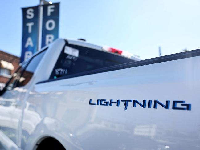 GLENDALE, CALIFORNIA - AUGUST 21: A Ford F-150 Lightning electric pickup truck is displayed for sale at a Ford dealership on August 21, 2024 in Glendale, California. Ford announced it is upending its electric vehicle (EV) strategy for North American vehicles to focus on hybrids, affordability, and longer ranges.   Mario Tama/Getty Images/AFP (Photo by MARIO TAMA / GETTY IMAGES NORTH AMERICA / Getty Images via AFP)