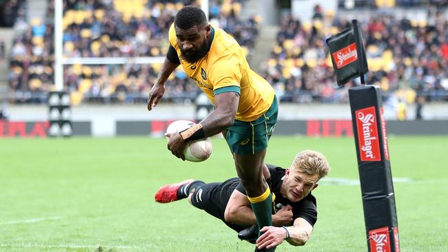 Wallabies winger Marika Koroibete dives over to score against the All Blacks at Sky Stadium in Wellington