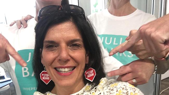 Independent MP Julian Banks shows of some #Stop Adani earrings. https://twitter.com/juliabanksmpcaption'My team know I love earrings and that I want to #StopAdani - so they bought me these!Just like the Flinders community, we are all committed to #StopAdani and move Australia towards a renewable future. #ClimateElection #FlindersVotes #AusVotes2019'