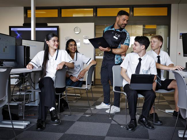 Oran Park High School computing students (L-R): Marwa Aamir, Samiksha Thapar (Year 12), their teacher Bojan Djoneski, Salvatore Tumminia and Joshua Mezzano-Lindner (Year 11). Picture: Sam Ruttyn