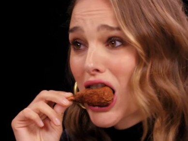 Natalie Portman eats a Shit the Bed Hot Sauce hot wing.