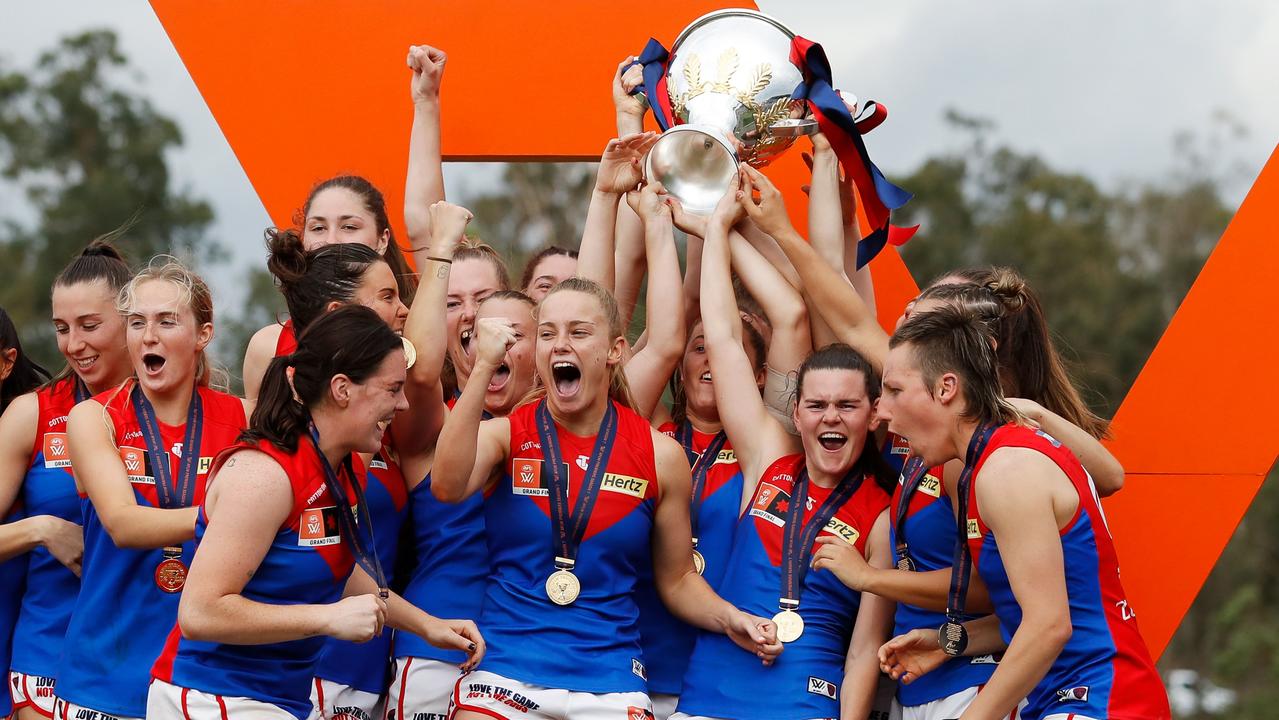 Melbourne players celebrate with the premiership cup last November. (Photo by Dylan Burns/AFL Photos via Getty Images)