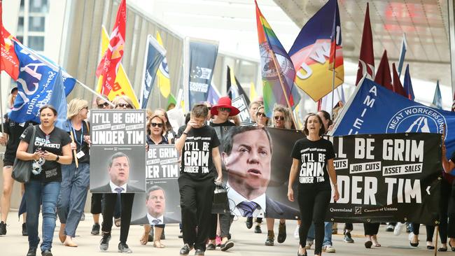 Union protestors from the Queensland Council of Unions (QCU) march through the Brisbane CBD in Brisbane, Wednesday, November 22, 2017. (AAP Image/Jono Searle) NO ARCHIVING