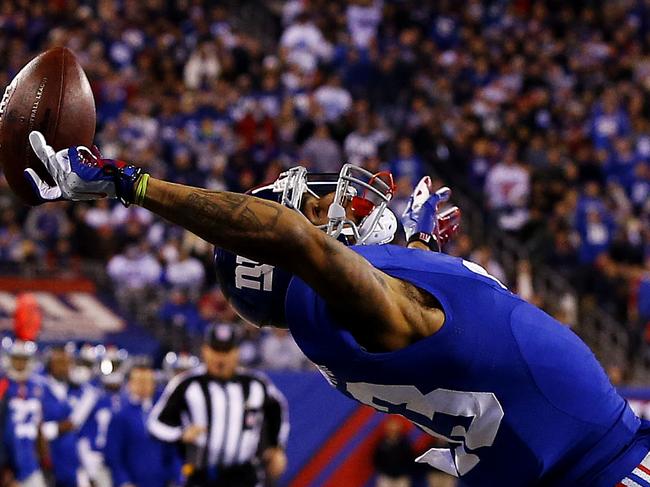 EAST RUTHERFORD, NJ - NOVEMBER 23: Odell Beckham #13 of the New York Giants scores a touchdown in the second quarter against the Dallas Cowboys at MetLife Stadium on November 23, 2014 in East Rutherford, New Jersey. (Photo by Al Bello/Getty Images)