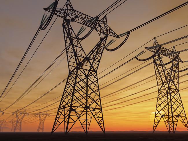 The silhouette of the high voltage power lines during sunset.