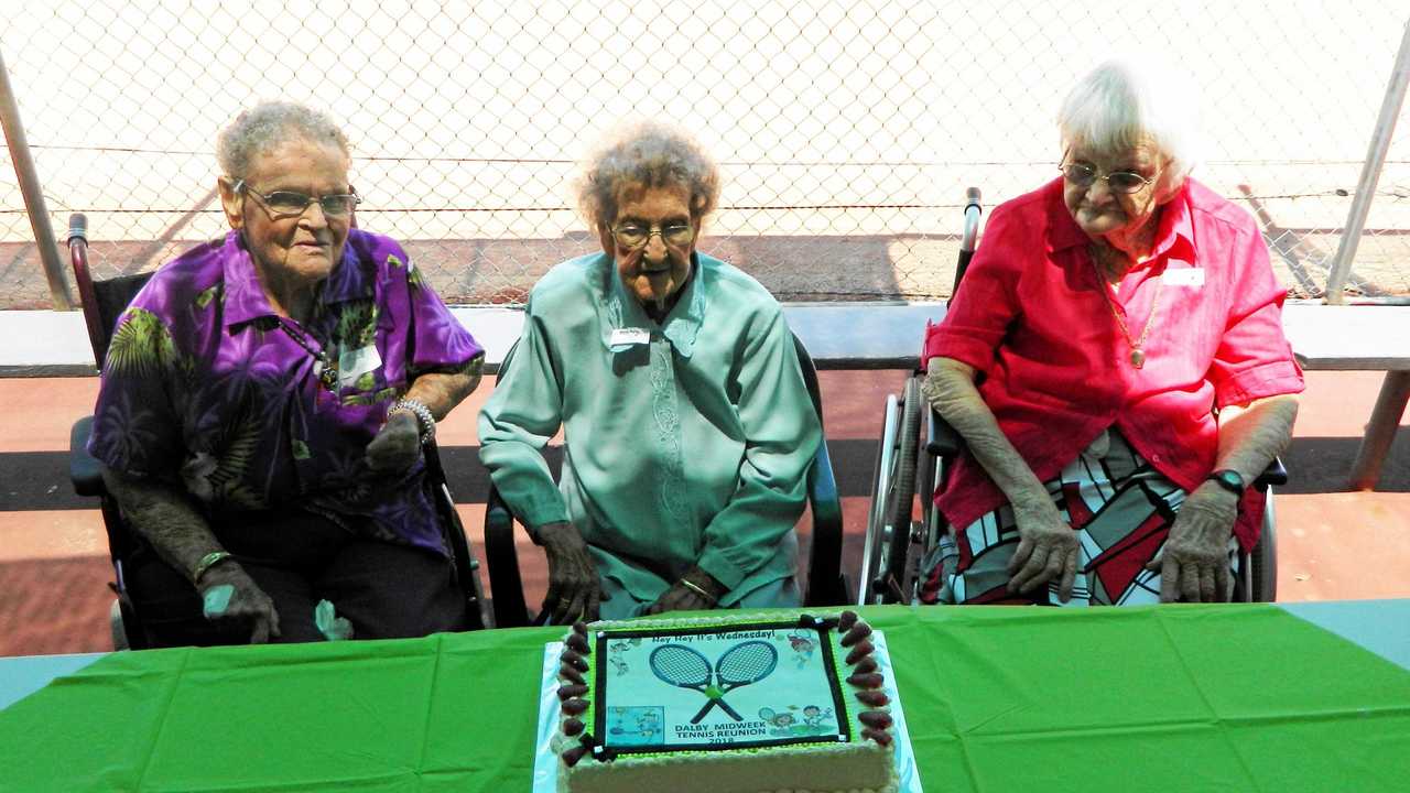 REUNITED: Glenys Brewer 93, Mavis Burns 96 and Kath Keleher 94 cut the cake at the Dalby Ladies Midweek Tennis reunion. Picture: Janet Hutchinson