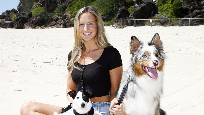 Jessica Wilson on the beach with her dogs Molly and Hunter. Picture: Tertius Pickard