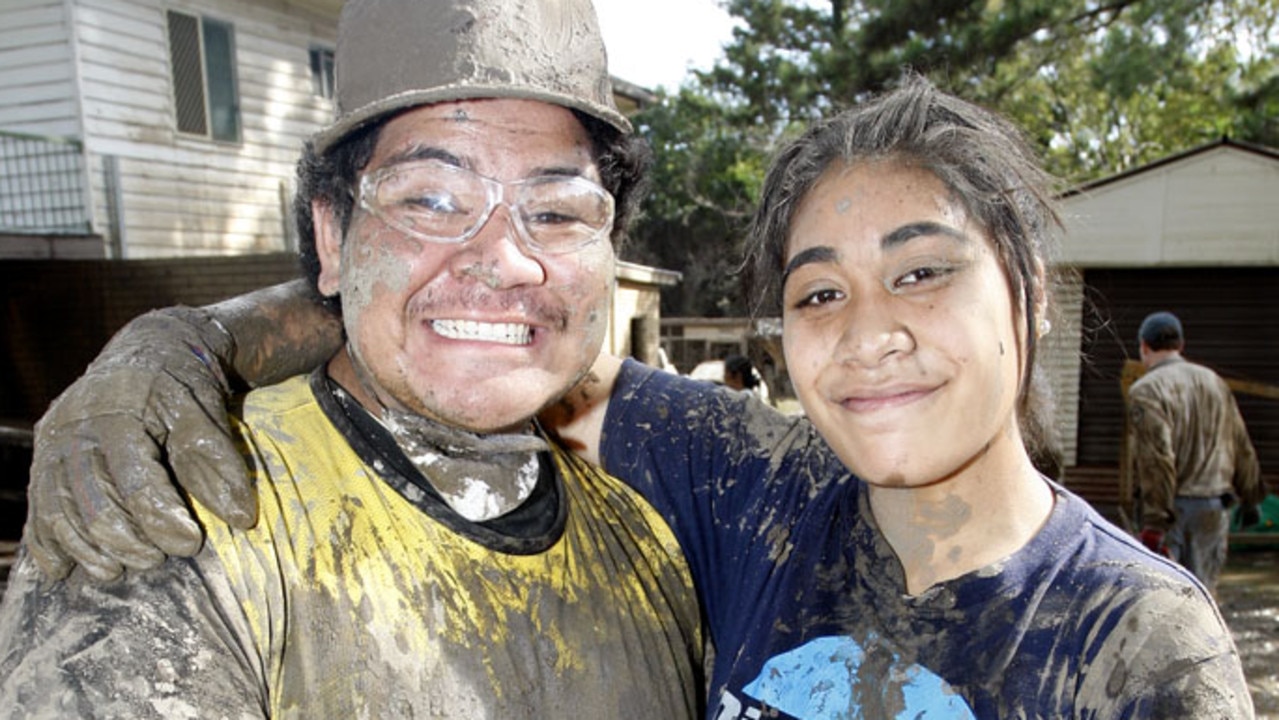 Volunteers Jesse Tamali and Angel Apelu helping with the flood clean up at Brisbane Tce, Goodna. Photo: Sarah Harvey/ The Queensland Times