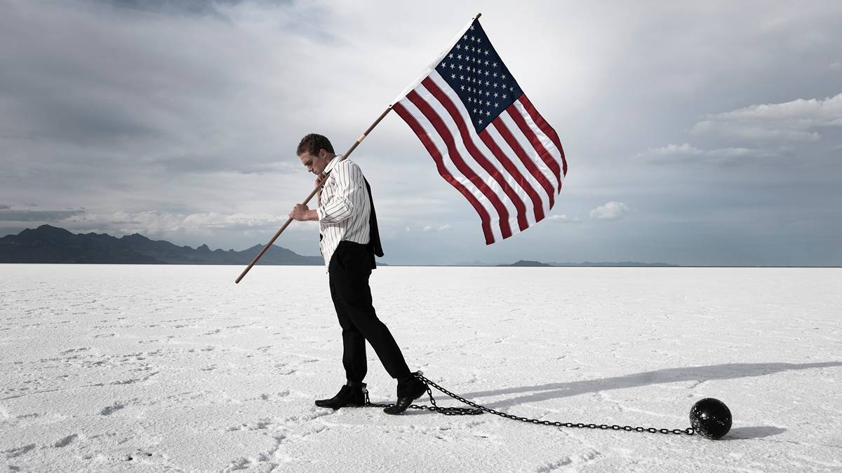 In attempting to free the US from its deficit ball and chain, Donald Trump risks enslaving it to other forces. Pic via Getty
