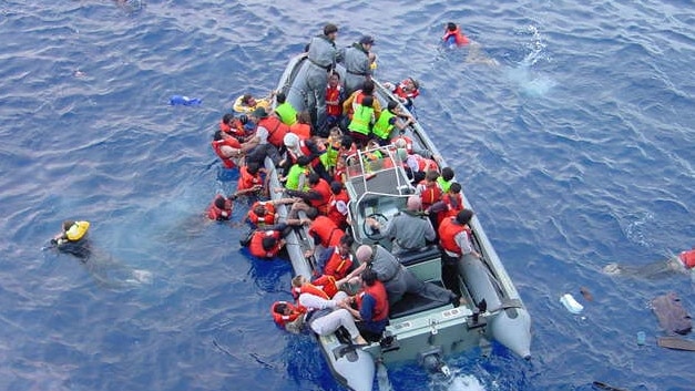 Asylum-seekers from a sinking vessel are rescued by the Royal Australian Navy in 2001. Picture: HMAS Adelaide