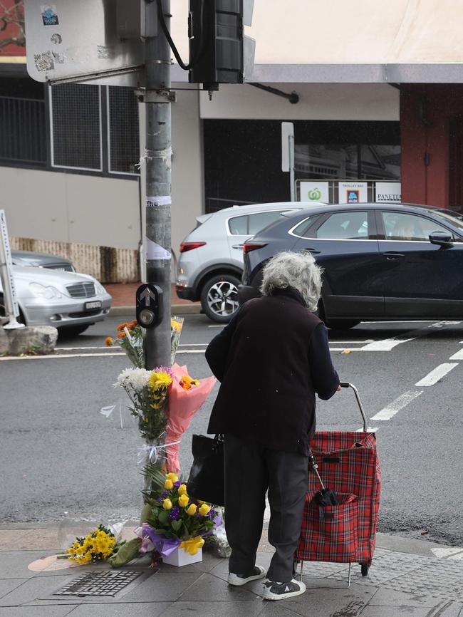 People stop to pay their respects. Picture: David Swift