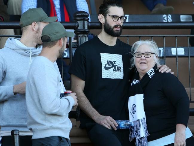 AFL star Brodie Grundy is seen hugging his mum, Jenn Palmer at Alberton Oval as they two watch younger son and brother Riley play for Port Adelaide in the SANFL in June. Picture: AAP/EMMA BRASIER