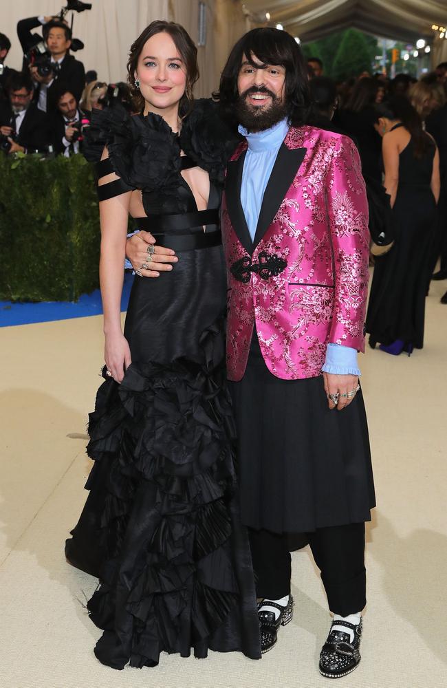 Dakota Johnson and Gucci creative director Alessandro Michele, who wore a Gucci blazer with an AC/DC logo on the back.