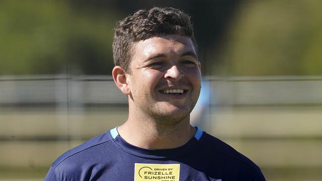 Ash Taylor smiles during the Gold Coast Titans training session on the Gold Coast, Monday, May 11, 2020. The NRL loosened COVID-19 restrictions today with contact work allowed to resume at training sessions. (AAP Image/Dave Hunt)