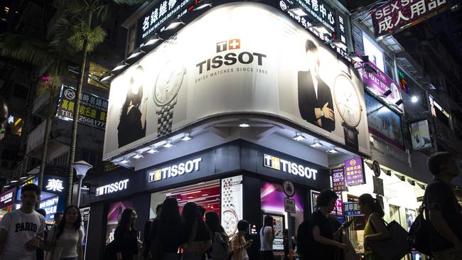 Pedestrians walk past a Tissot SA store in the Causeway Bay district of Hong Kong. Tissot posted a loss of 53 million Swiss francs ($74.73m) in 2020, its first since 1983 when Swatch Group launched its first plastic watch. Picture: Bloomberg