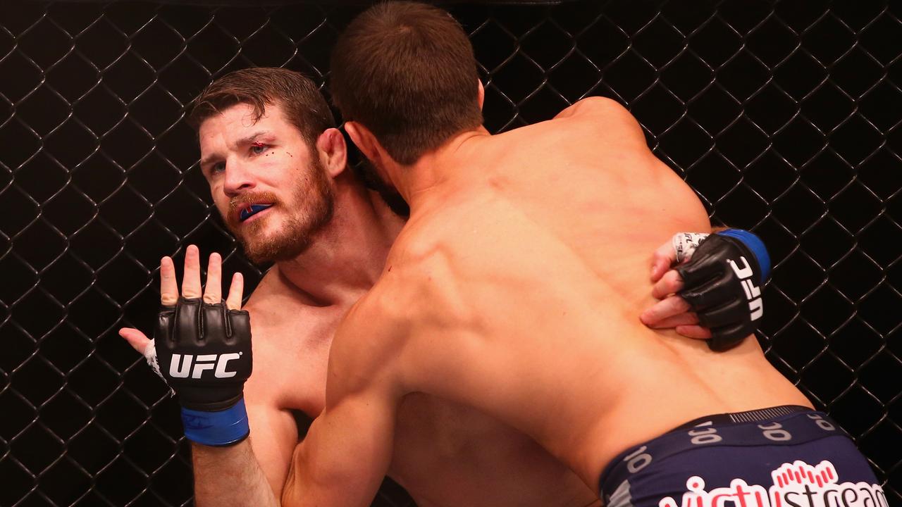 SYDNEY, AUSTRALIA - NOVEMBER 08: Michael Bisping appeals to the referee after being cut above the eye by Luke Rockhold in their middleweight fight during the UFC Fight Night 55 event at Allphones Arena on November 8, 2014 in Sydney, Australia. (Photo by Mark Kolbe/Getty Images)