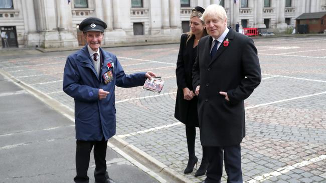 Britain Prime Minister Boris Johnson with partner Carrie Symonds and army veteran Ian Aitchison. Picture: Getty Images