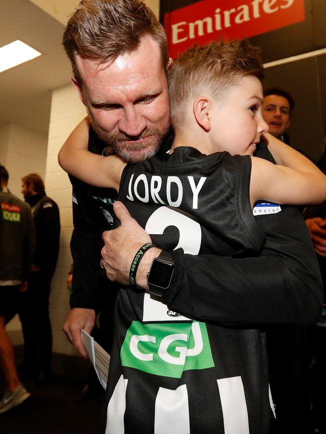 Nathan Buckley gives son Ayce a hug after the win. Pic: AFL Media