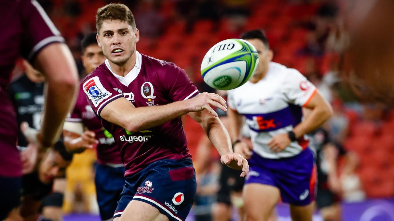 Reds star James O'Connor passes the ball during a Super Rugby match.