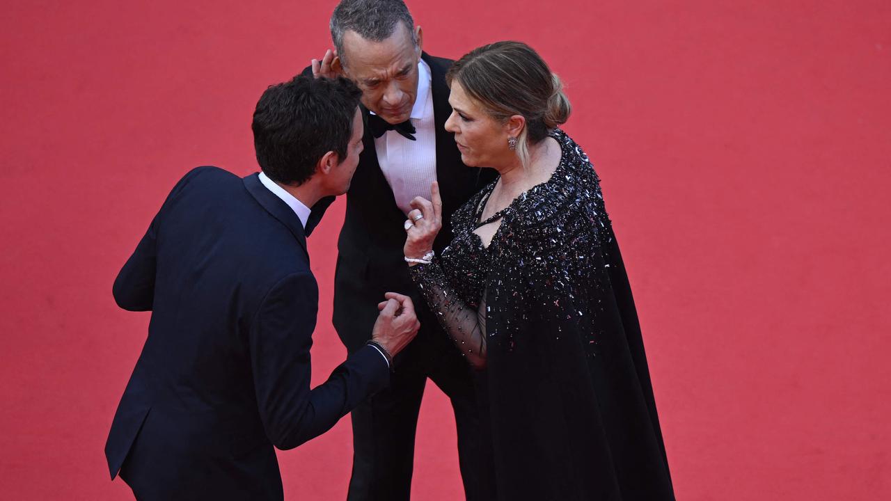 Rita Wilson said they were just trying to hear above the red carpet din. (Photo by Antonin THUILLIER / AFP)