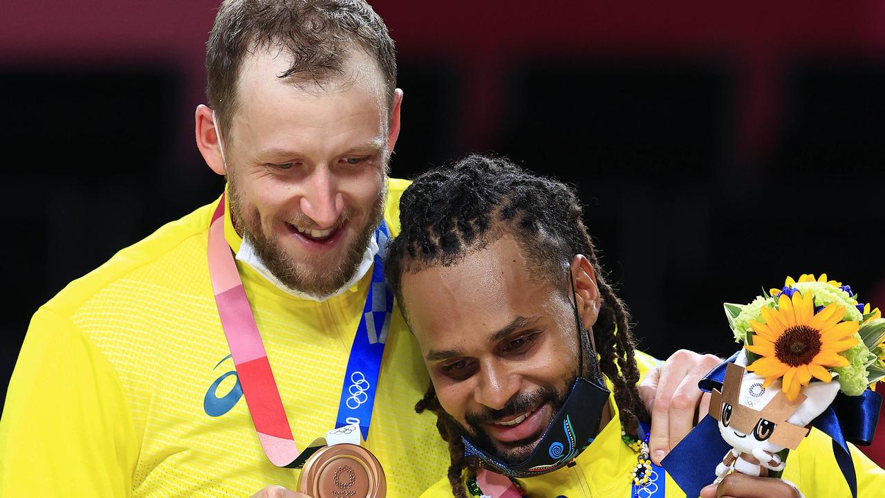 Joe Ingles, Patty Mills and Australia celebrates winning the Bronze medal playoff Basketball game between Australia and Slovenia at the Saitama Super Arena during the Tokyo 2020 Olympics. Pics Adam Head