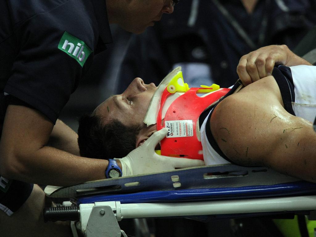 Geelong footballer Harry Taylor was stretchered from the ground.