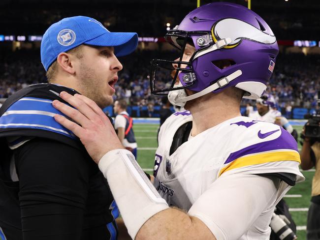 DETROIT, MICHIGAN - JANUARY 05: Jared Goff #16 of the Detroit Lions speaks with Sam Darnold #14 of the Minnesota Vikings after the game at Ford Field on January 05, 2025 in Detroit, Michigan. (Photo by Gregory Shamus/Getty Images)