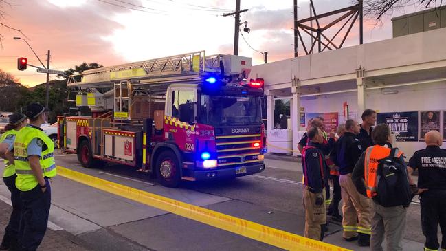 Proper removal: Fire and Rescue NSW called in to provide a constant sprayed mist to ensure asbestos does not become airborne during a building demolition at Balgowlah. Picture: Jim O'Rourke