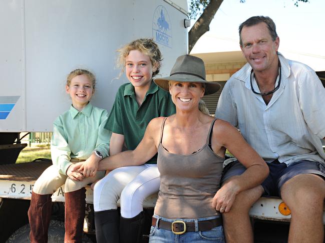 Billie Kinder with her parents Danny and Dave and her older sister Charlie.