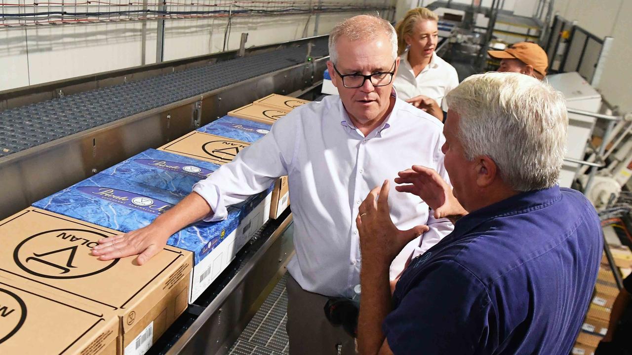 Prime Minster Scott Morrison visits Nolan Meats, Gympie, after devastating floods. Pictured with Terry Nolan. Photo: Patrick Woods.