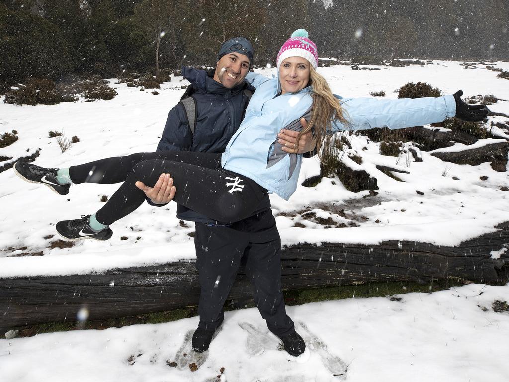 Chris and Michelle Parker of Brisbane enjoy the snow at Cradle Mountain. PICTURE CHRIS KIDD