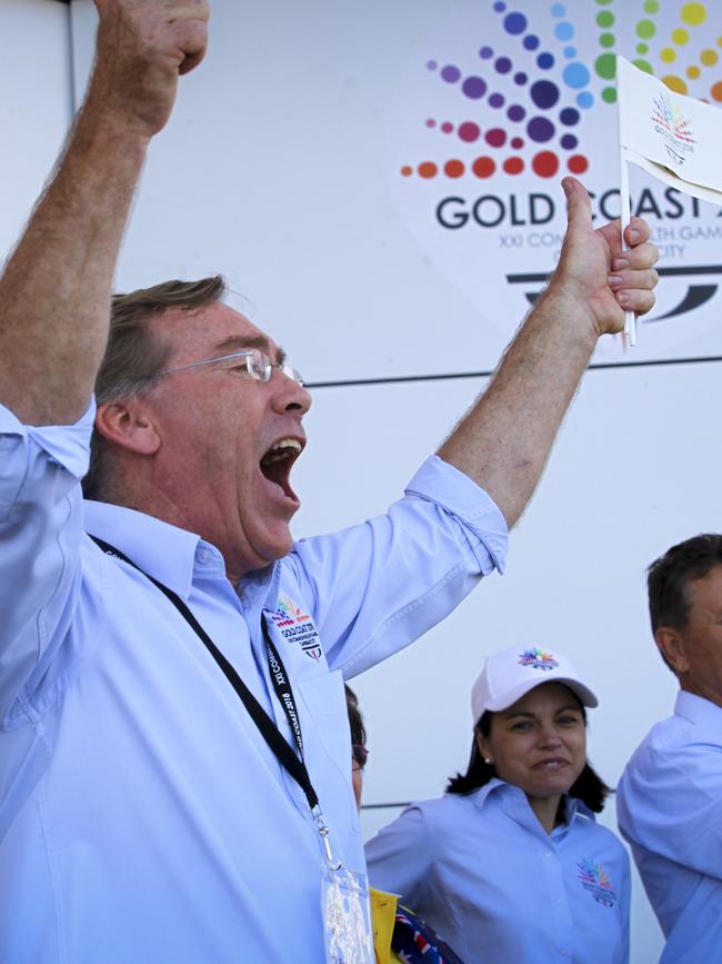 Gold Coast City Councillor Peter Young leaps in celebration following the announcement of the Gold Coast's winning bid for the 2018 Commonwealth Games. (AAP Image/Patrick Hamilton)