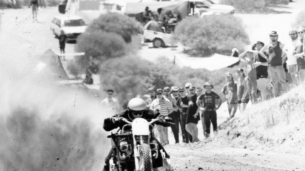 Hell’s Angels rider Gary Joerin on V8 drag racing bike in the sand drags at Ponde music festival near Mannum, 17 Feb 1996.