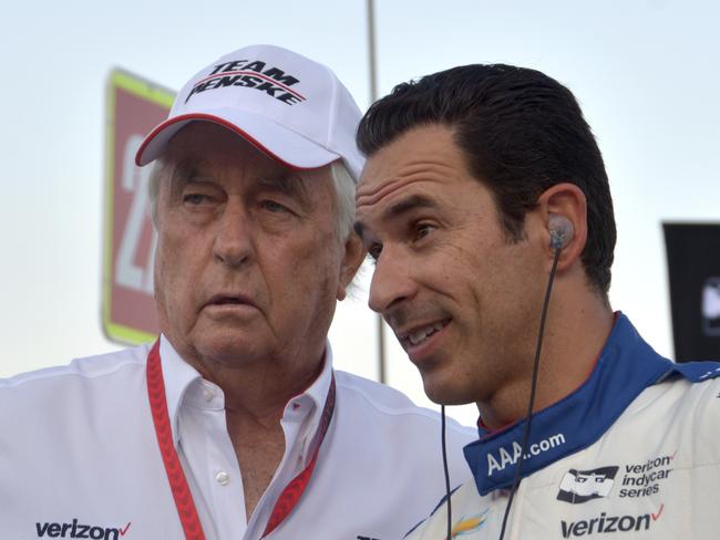 Johnsons partner Roger Penske with three-time Indianapolis 500 winner Helio Castroneves. Picture: AP