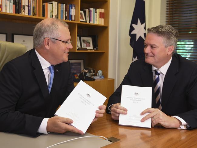 Australian Federal Treasurer Scott Morrison and Australian Finance Minister Mathias Cormann with the Midyear Economic and Fiscal Outlook 2017/18. Picture: AAP/Lukas Coch