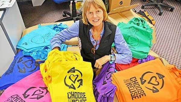 Lismore City Council's Waste Education Officer Barbara Jensen with some of the colourful new reusable bags Council will be distributing during Plastic Free July that feature designs by local artists.