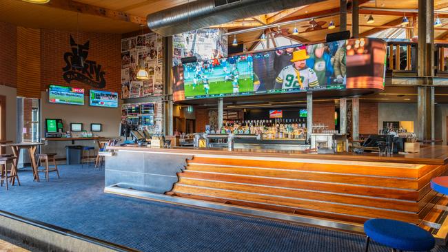 The new outdoor area includes a 360-degree wraparound LED screen, booth seating, a fireplace, shuffleboard, digital darts and a pool table. Picture: Supplied