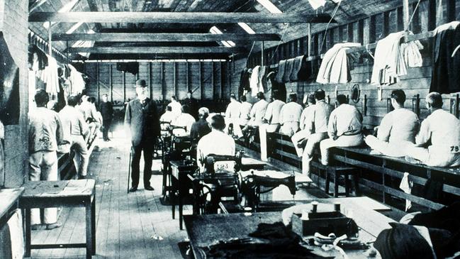 St Helena Island’s prison tailor shop with disgraced prisoners forced to avert their faces. Picture: Courtesy of the John Oxley Library