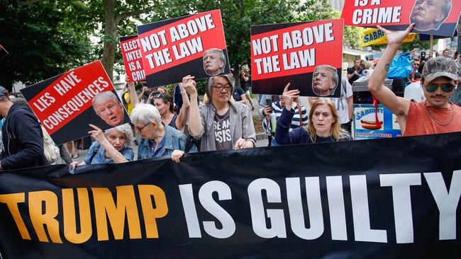 People react after former US President and Republican presidential candidate Donald Trump was convicted. Photo by Kena Betancur / AFP.