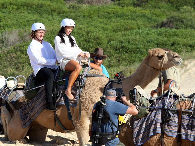 They then jumped on a camel together. Picture: Nathan Edwards